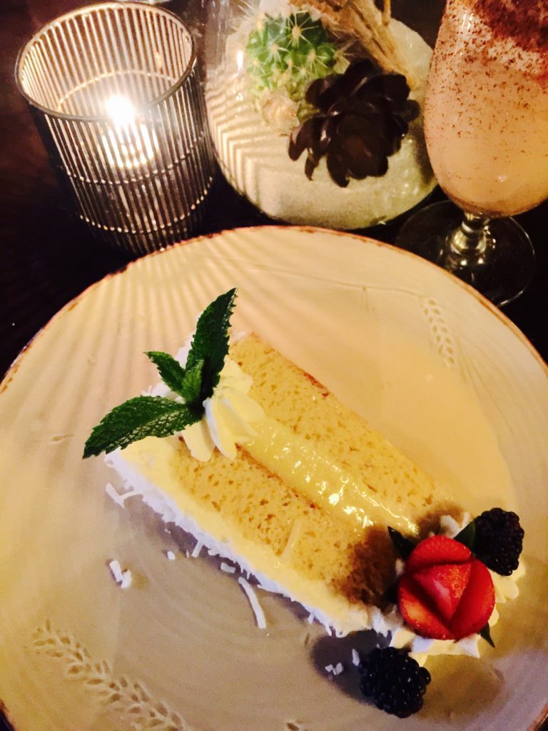 "Signature" Coconut Tres Leches Vanilla Cake, centered with coconut flan 